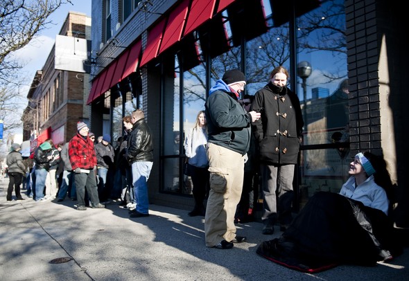 Deb Touchinski, John Matters, and Olivia Cholewa wait outside Underground Sounds for the doors to open for Record Store Day on Saturday, April 20. They have been waiting outside for about two hours but the earliest customer arrived at 3 a.m.  Daniel Brenner I AnnArbor.com
